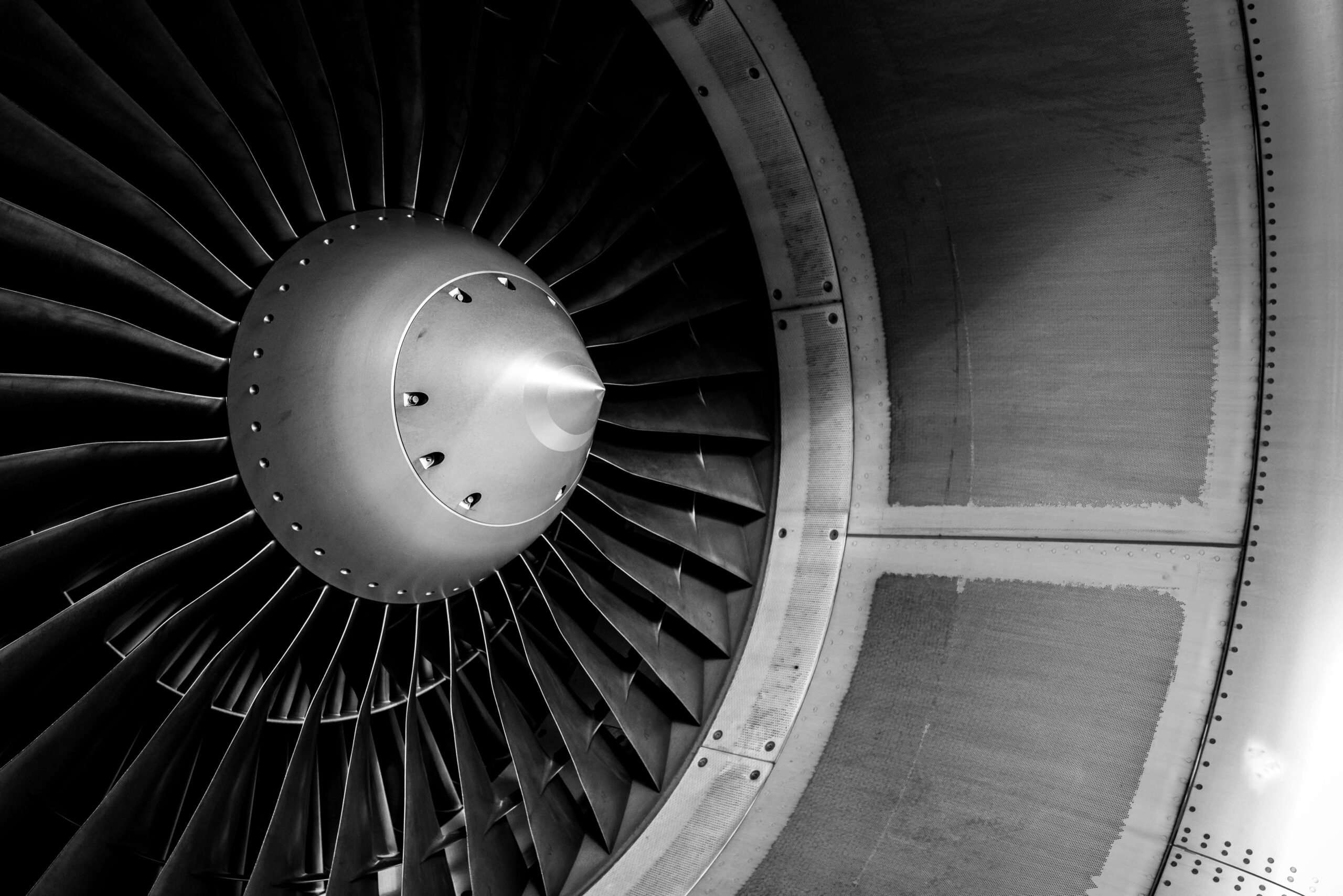 Blades of an aircraft engine close-up. Travel and aerospace concept. Black and white filter.